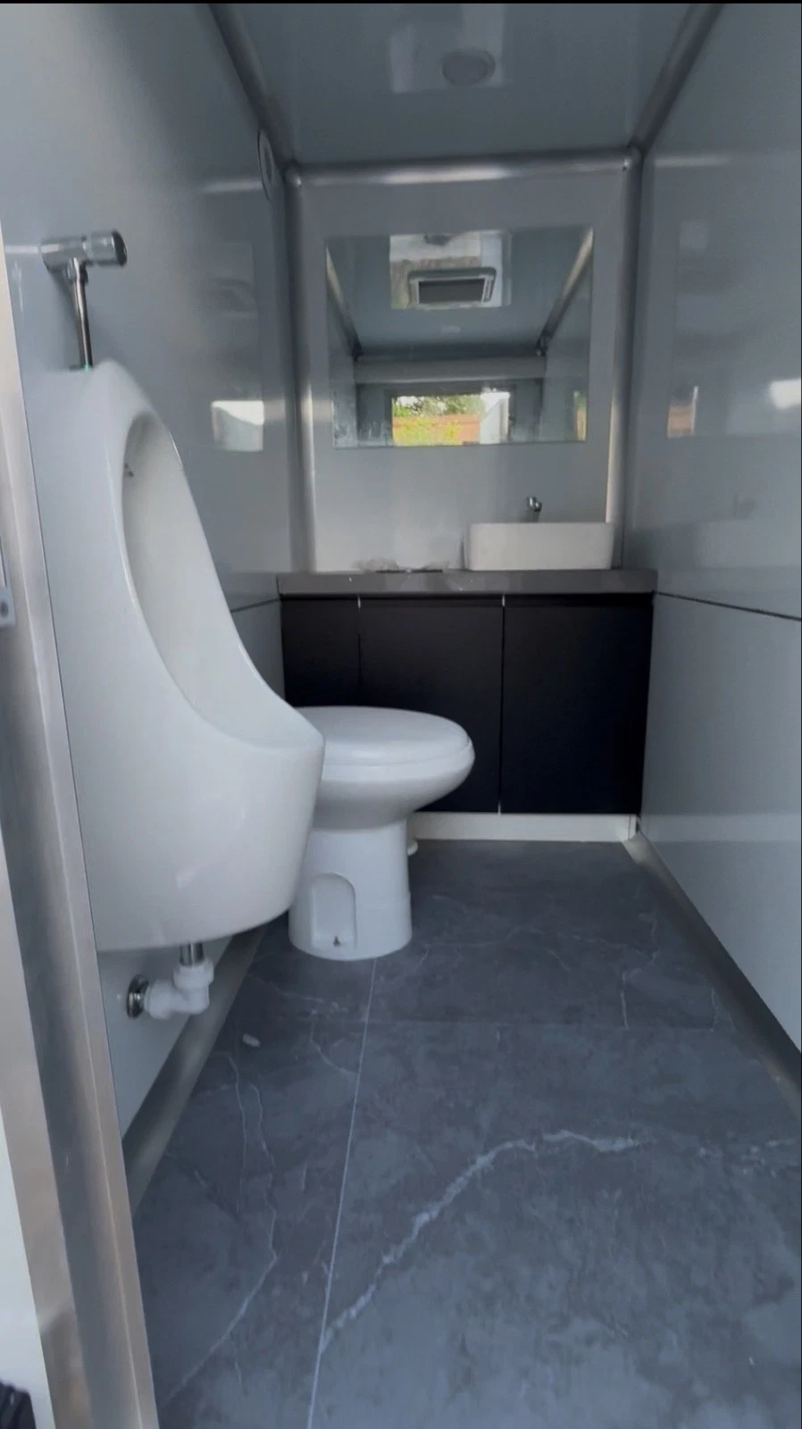 Restroom trailer set up for an evening corporate event