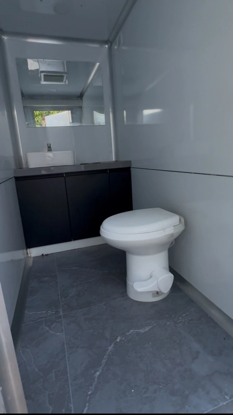 Restroom trailer supporting a facilities placement
