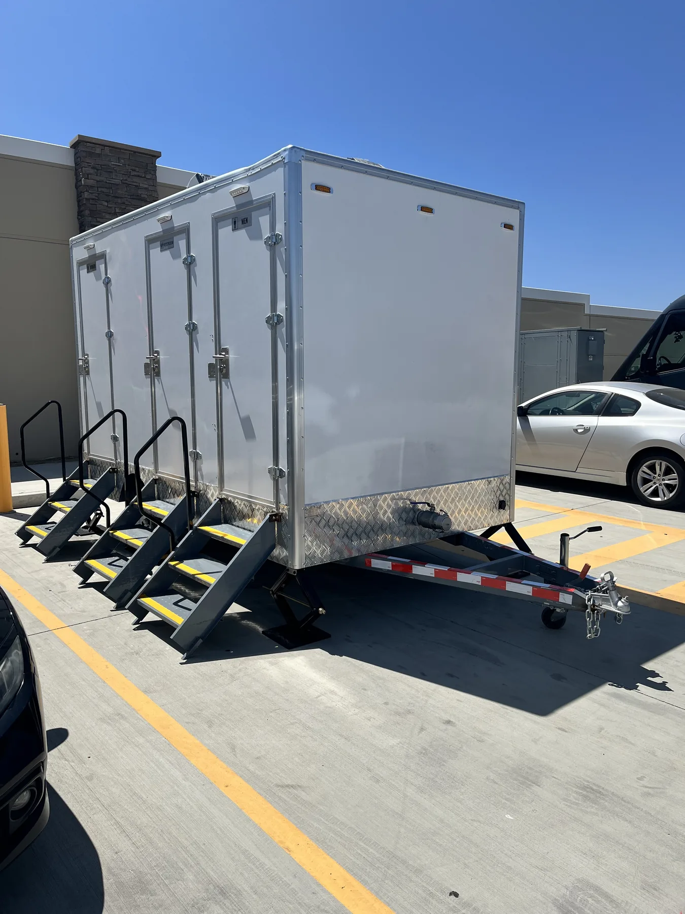 Lux Loos restroom trailer parked and leveled on site
